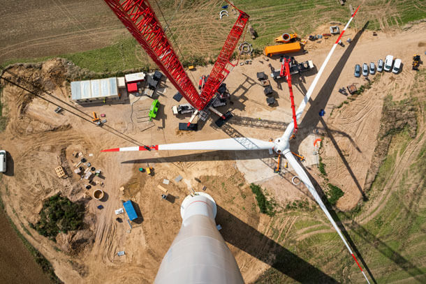 An downward look at a the propellers of a wind turbine being built.